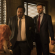 Leslie David Baker and Joel McHale question a key puppet in The Happytime Murders.
